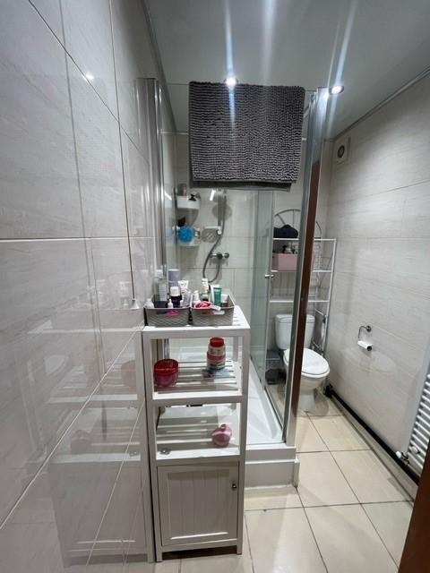A well-maintained bathroom featuring a large va...