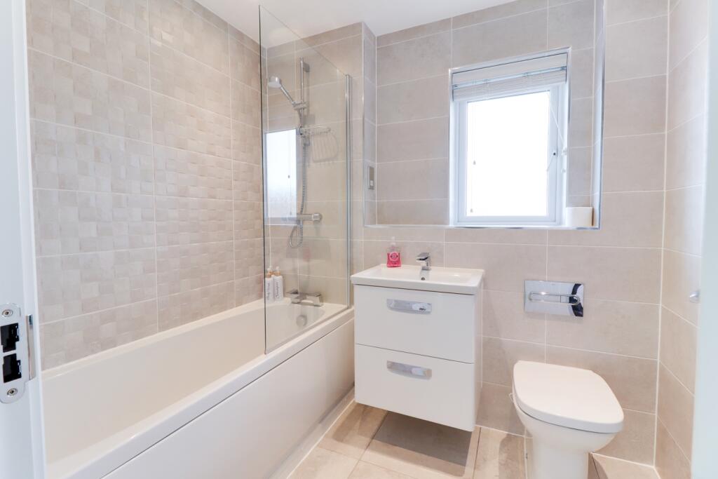 family bathroom with over shower