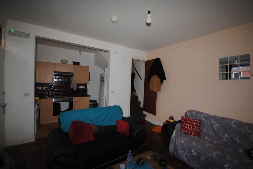 A cozy living room featuring comfortable sofas ...