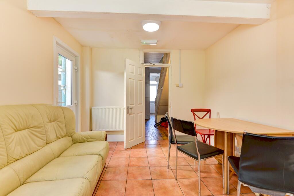 A bright living room featuring a comfortable so...