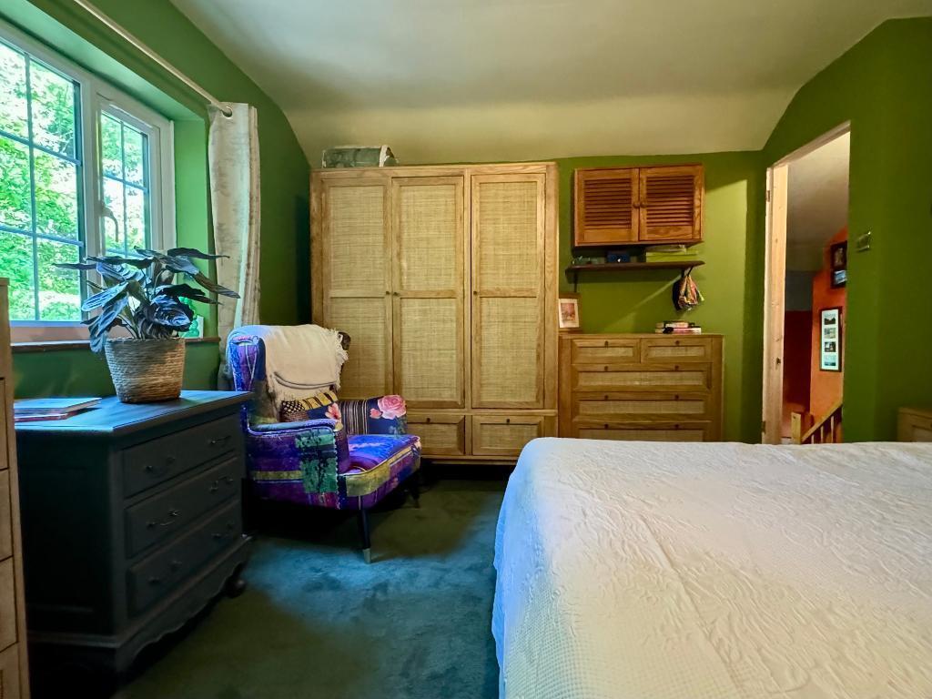 Main bedroom with leafy views