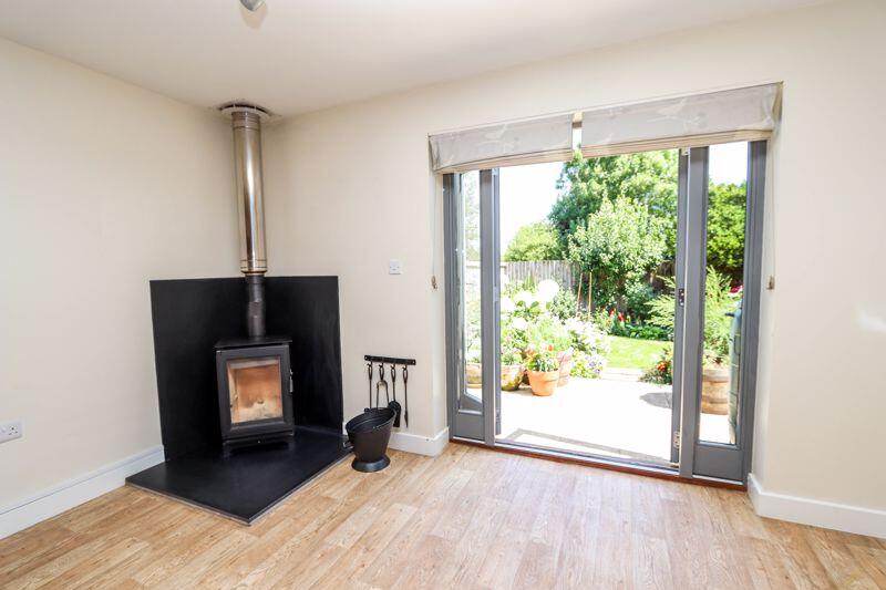 Woodburning Stove and doors to garden