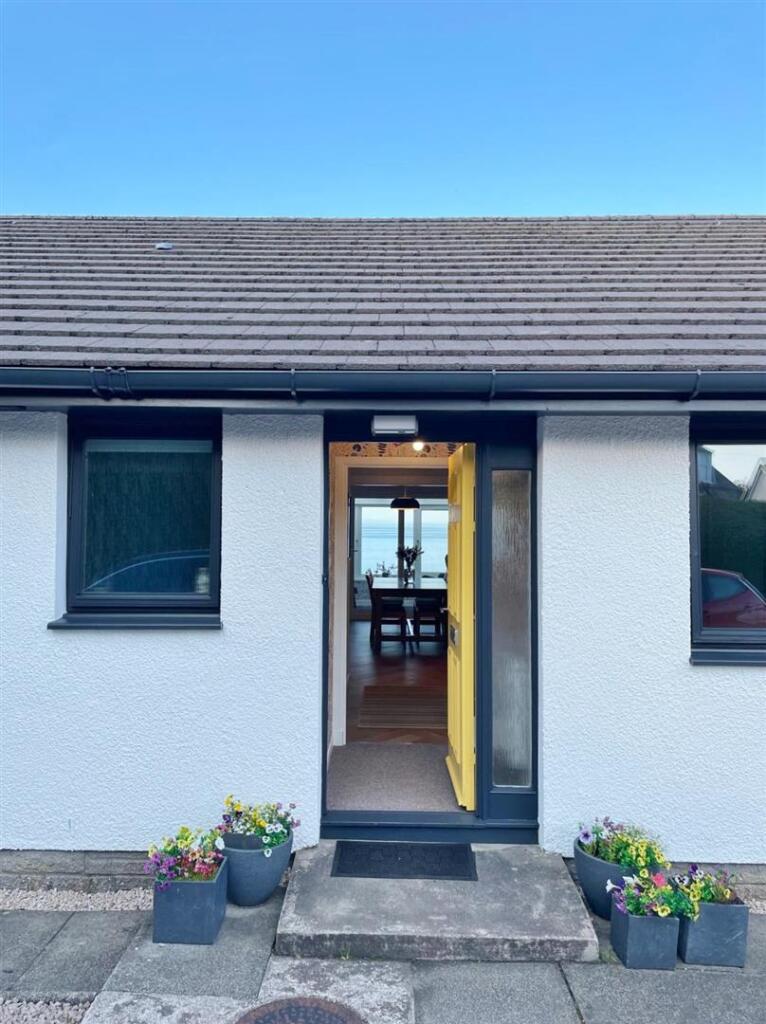 View through house to sea