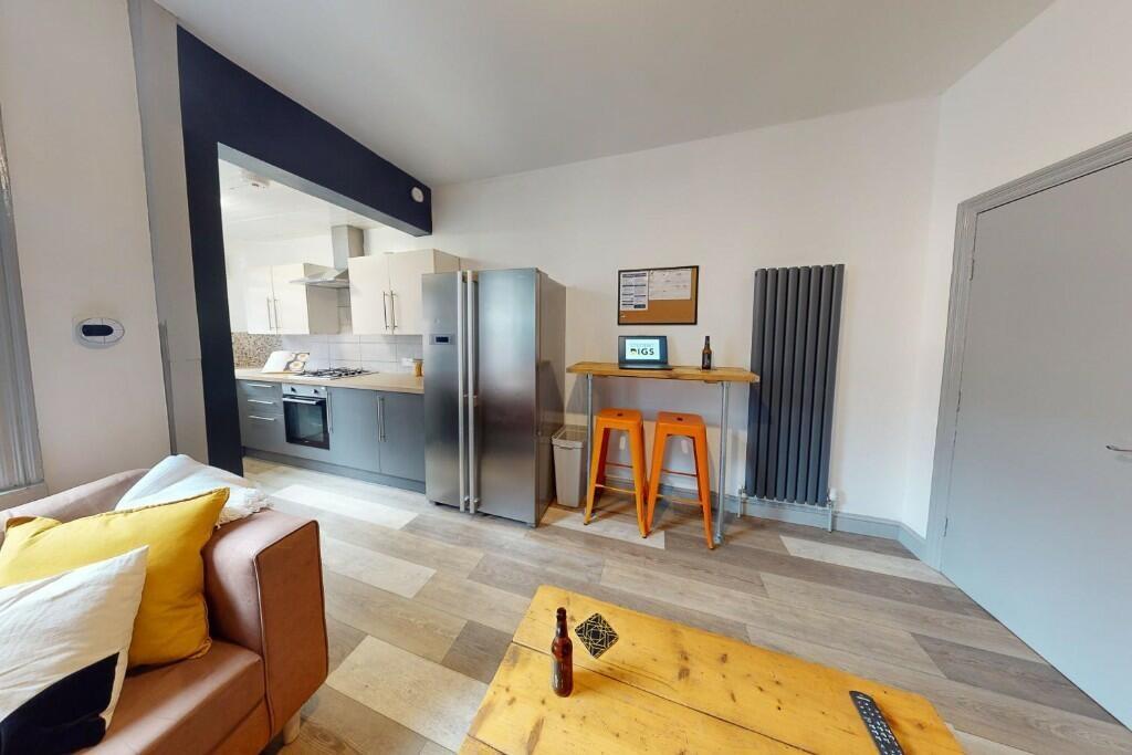 A modern kitchen area featuring stainless steel...