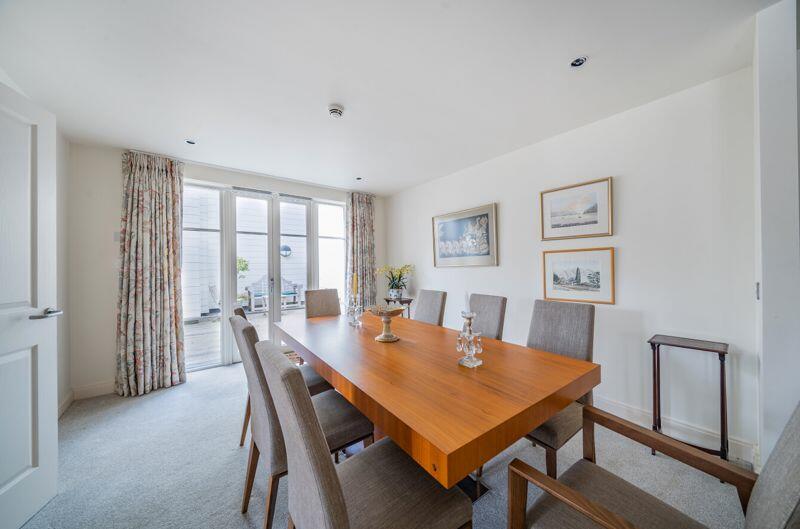 Dining alcove off living room with ro...