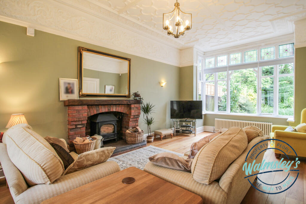 Left wing impressive sitting room with sun room si
