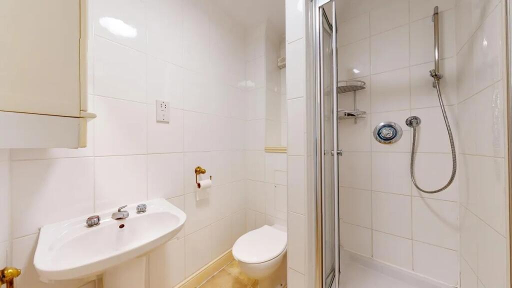 A clean, well-maintained bathroom featuring a c...