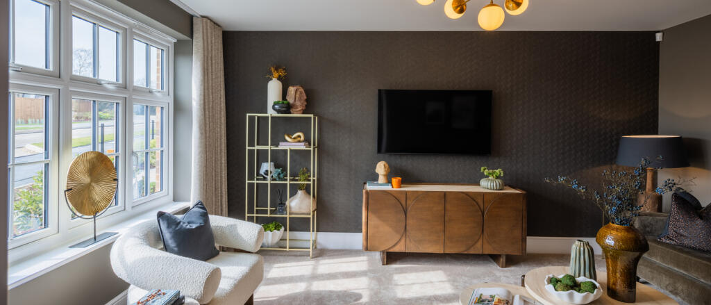 Modern living room with large window, dark accent wall, wall-mounted TV, and stylish furniture and d