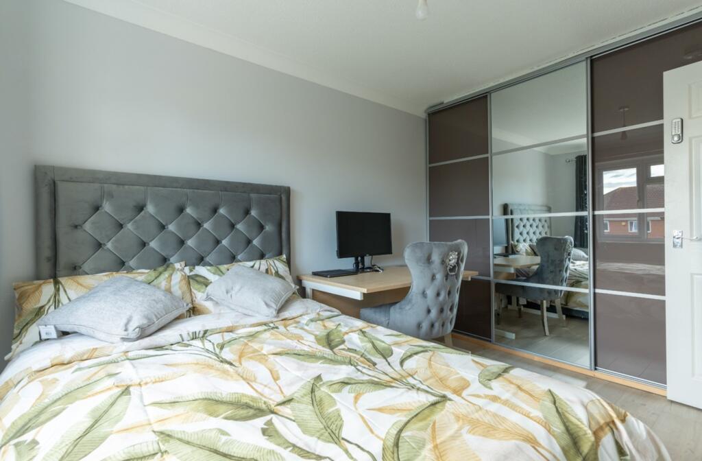 A stylish and inviting double bedroom with mode...