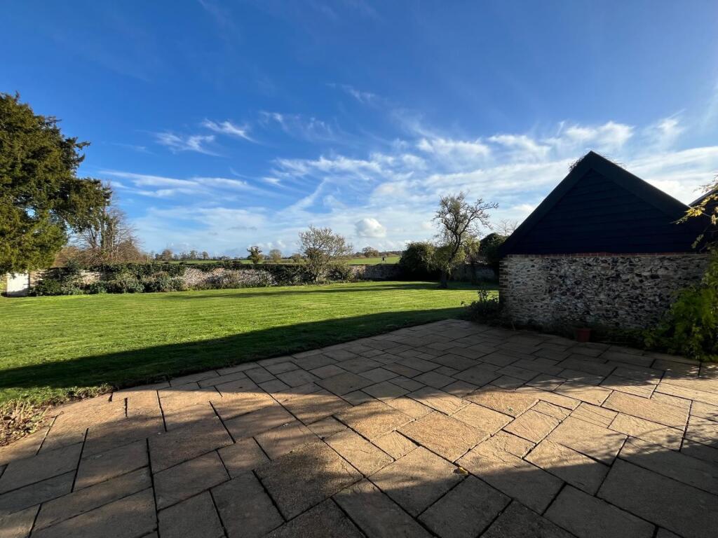 Patio with views over rear garden