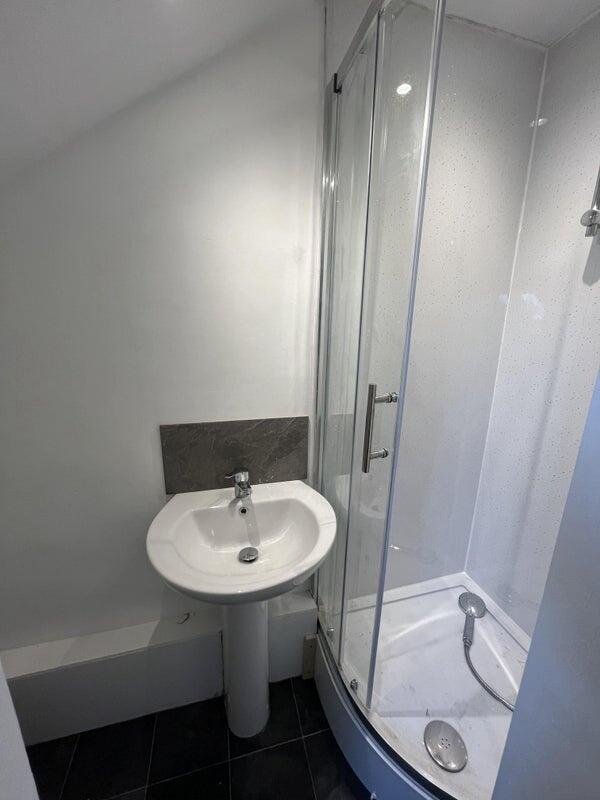 Compact and clean bathroom featuring a modern c...