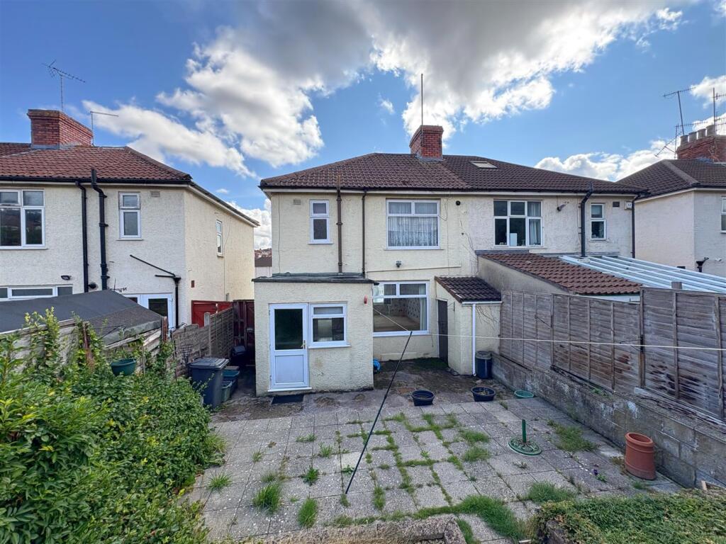 Rear view of property and patio (1).jpg