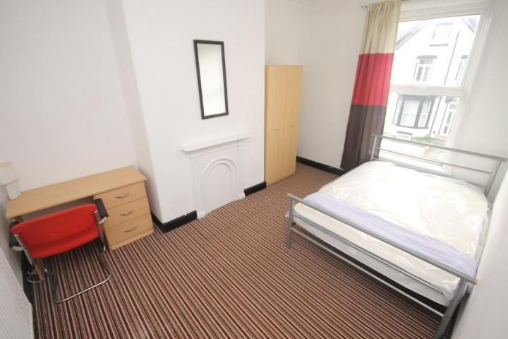 Bright and tidy double bedroom featuring a comf...