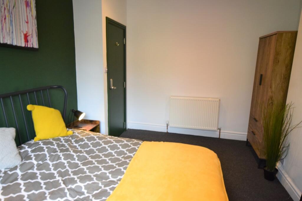 A stylish and inviting double bedroom featuring...