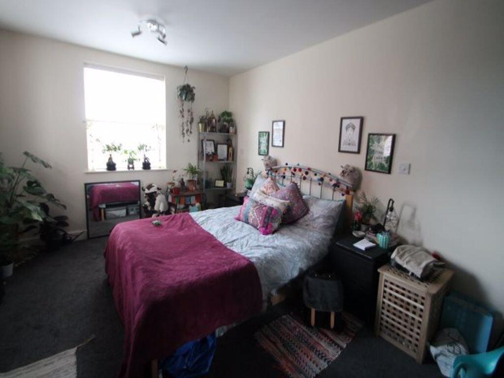 Bright and inviting double bedroom featuring a ...