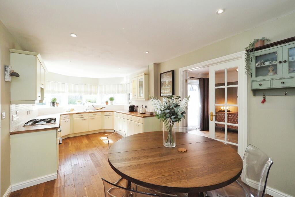 Stunning Open Plan Kitchen/Dining with Feature Window filtering through Natural Light