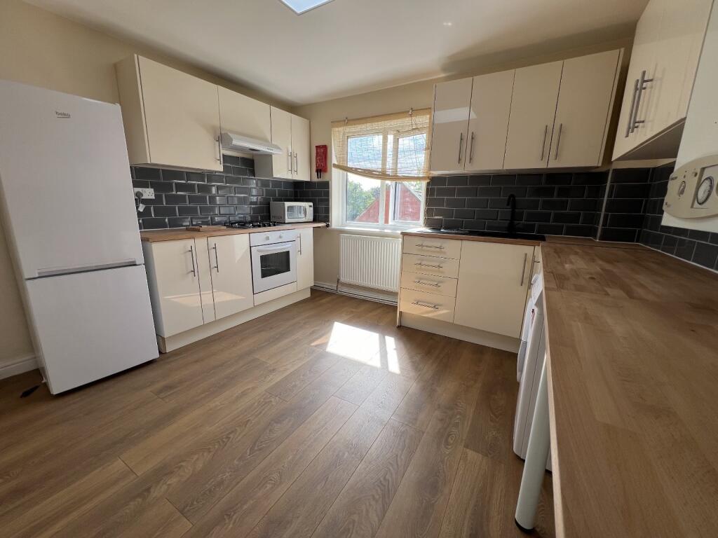 Modern, well-maintained kitchen featuring ample...