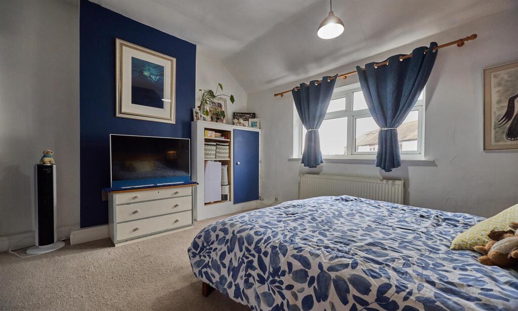 BEDROOM ONE TO FRONT
