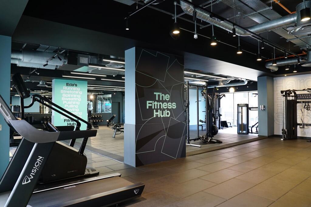A modern fitness hub featuring an array of gym ...