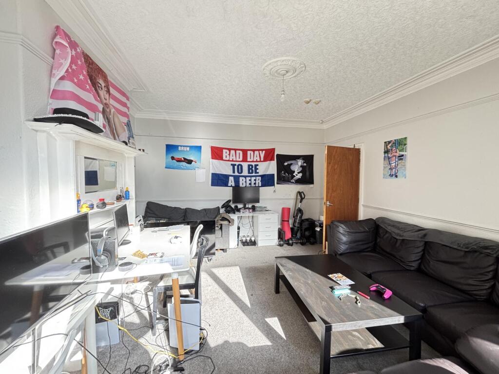 A bright, spacious living room with comfortable...