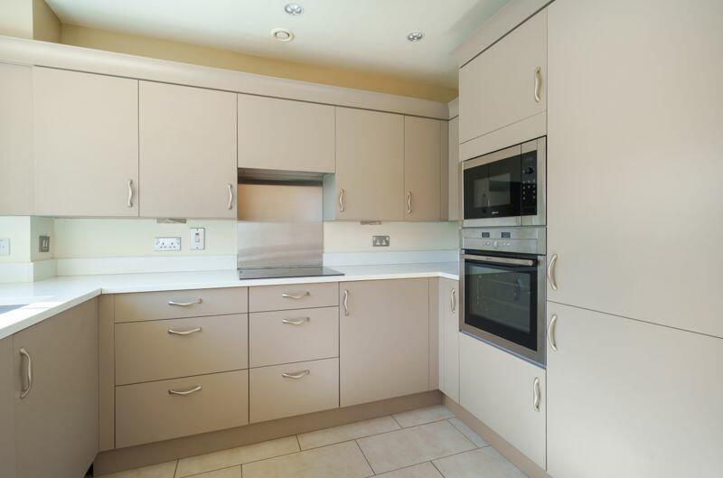 Kitchen with built-in appliances