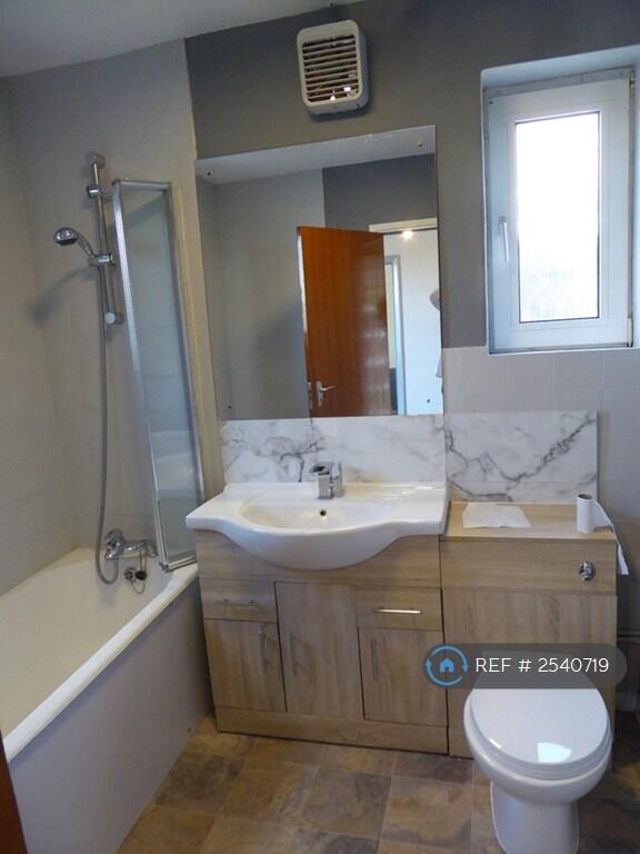 Modern Fitted Bathroom With Shower Over Bath.