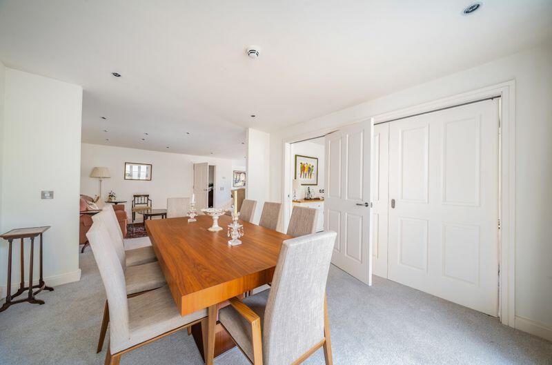 Dining area with bi-fold doors to kit...
