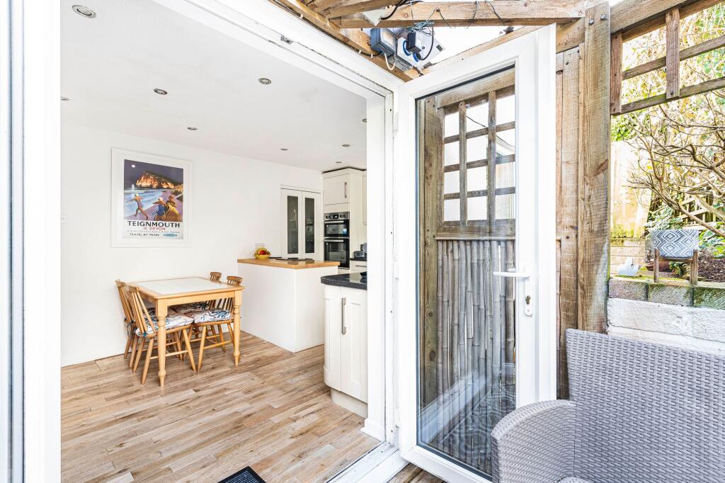 Outer seating area into dining room and kitchen