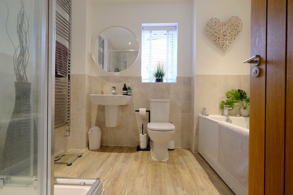 Family bathroom with bath and shower