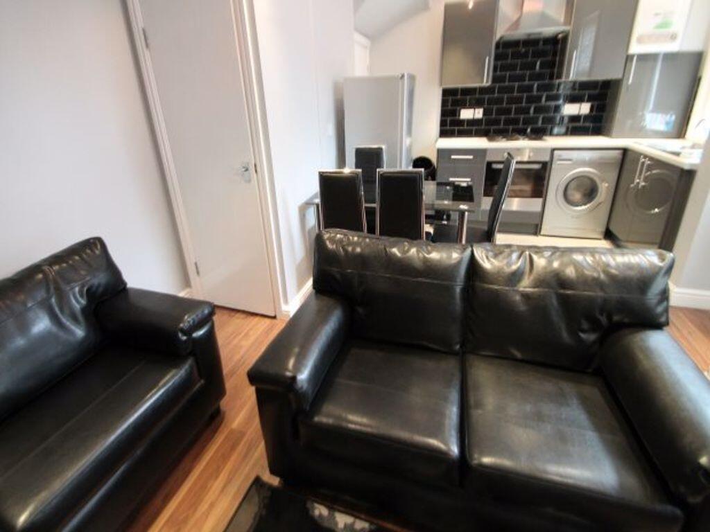 A modern living space featuring comfortable bla...