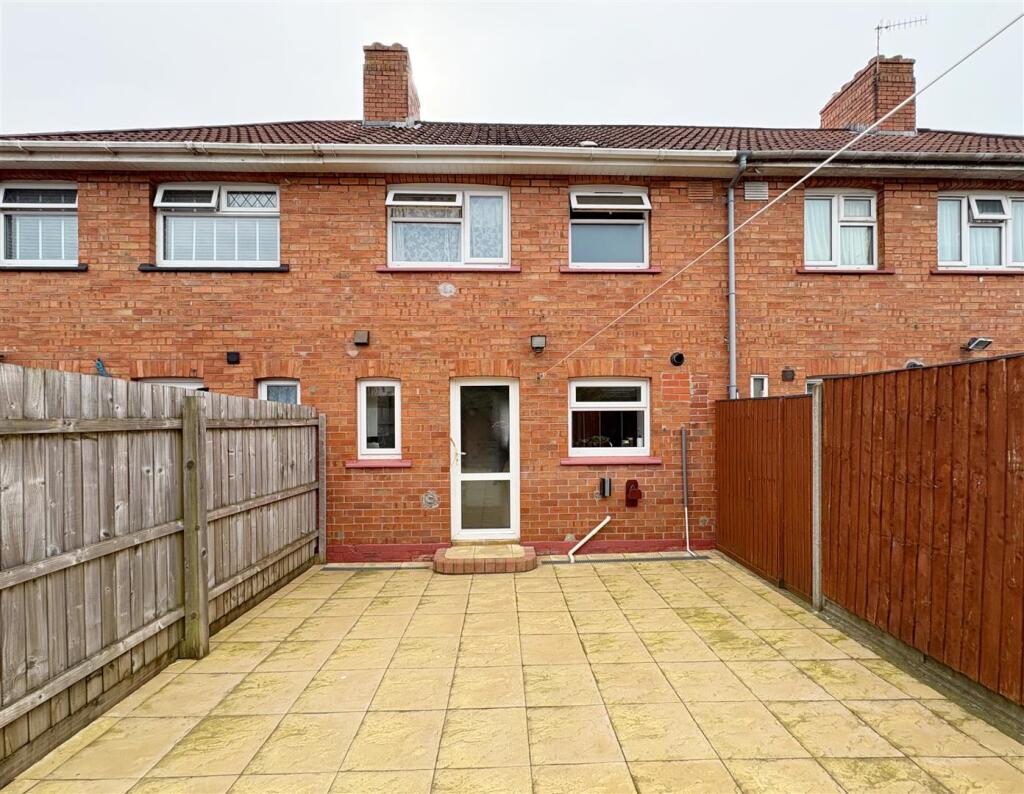 Rear view of property and patio.jpg