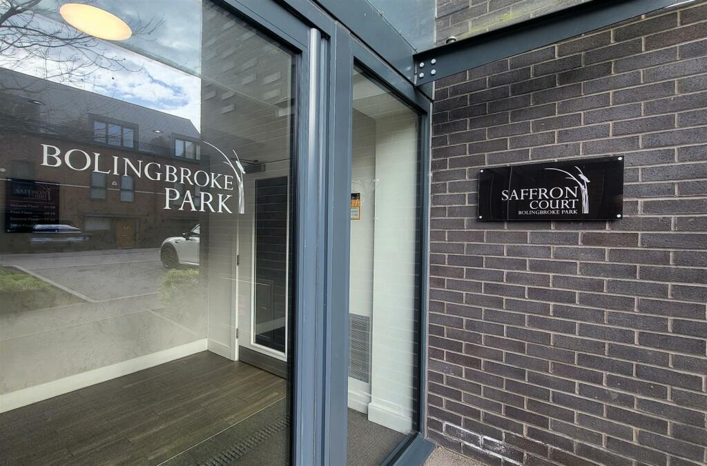 FRONT ENTRANCE TO APARTMENTS