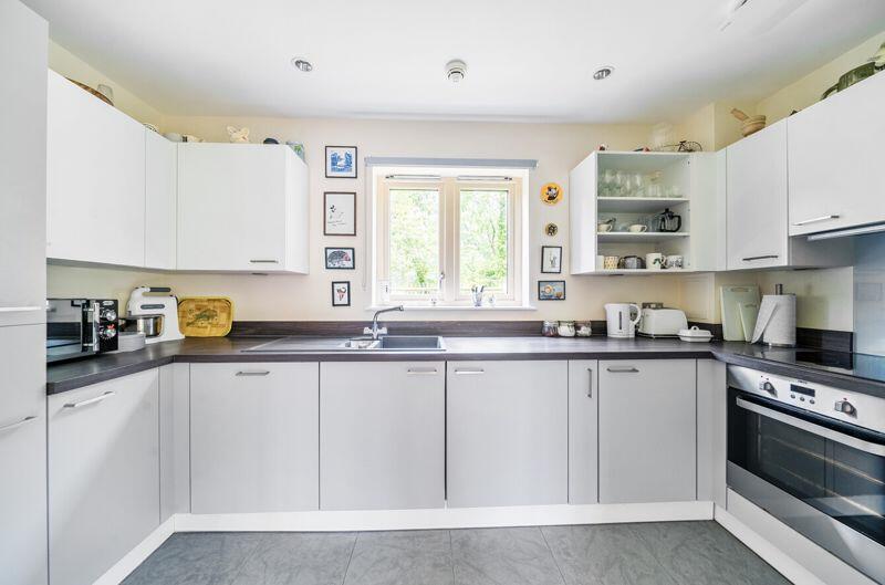 Kitchen with built-in appliances