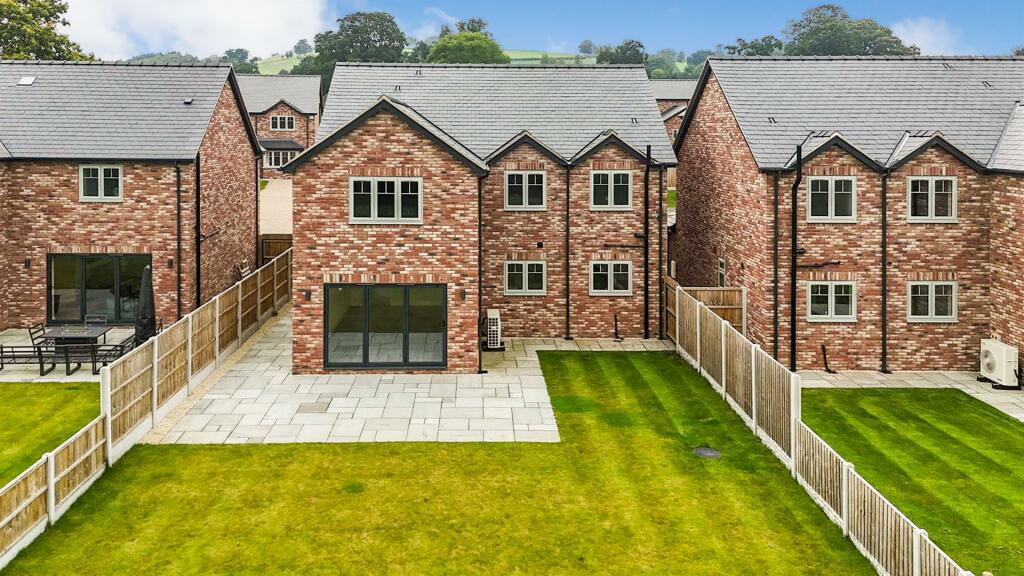 To The Rear Of The Property