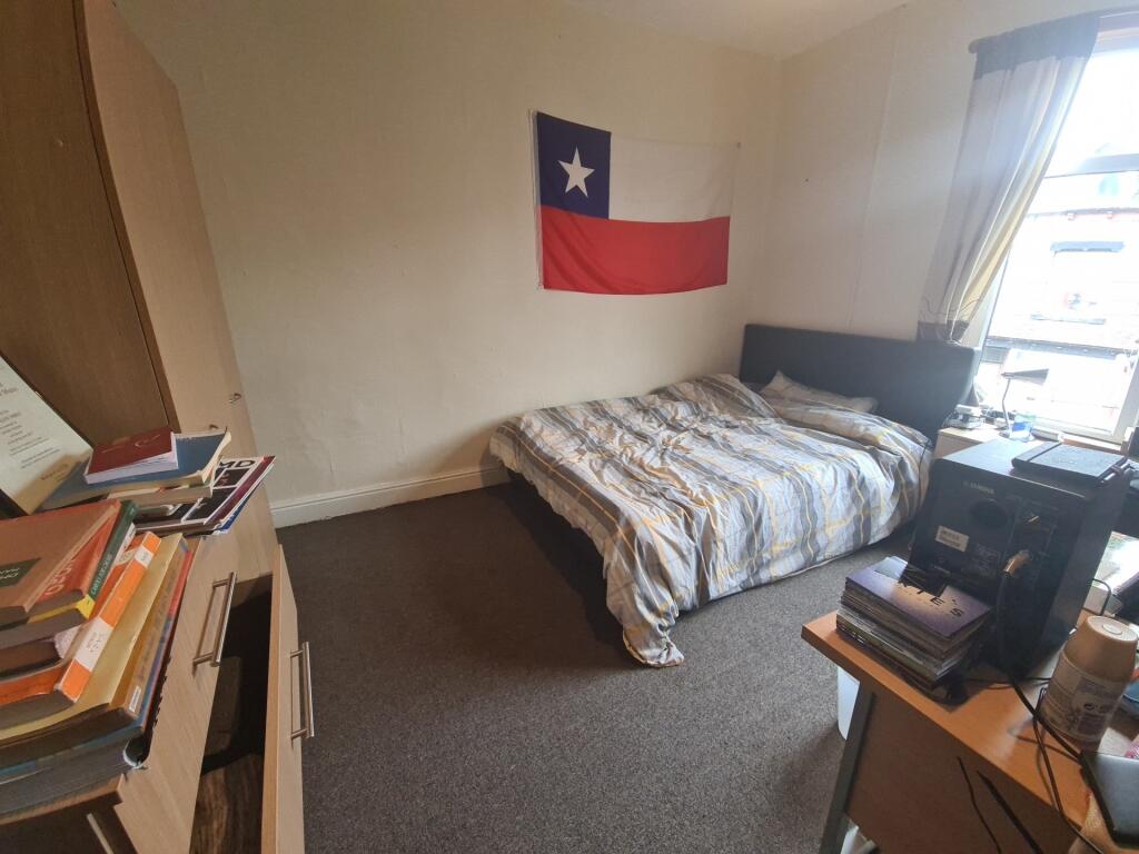 A cozy double bedroom featuring a comfortable d...