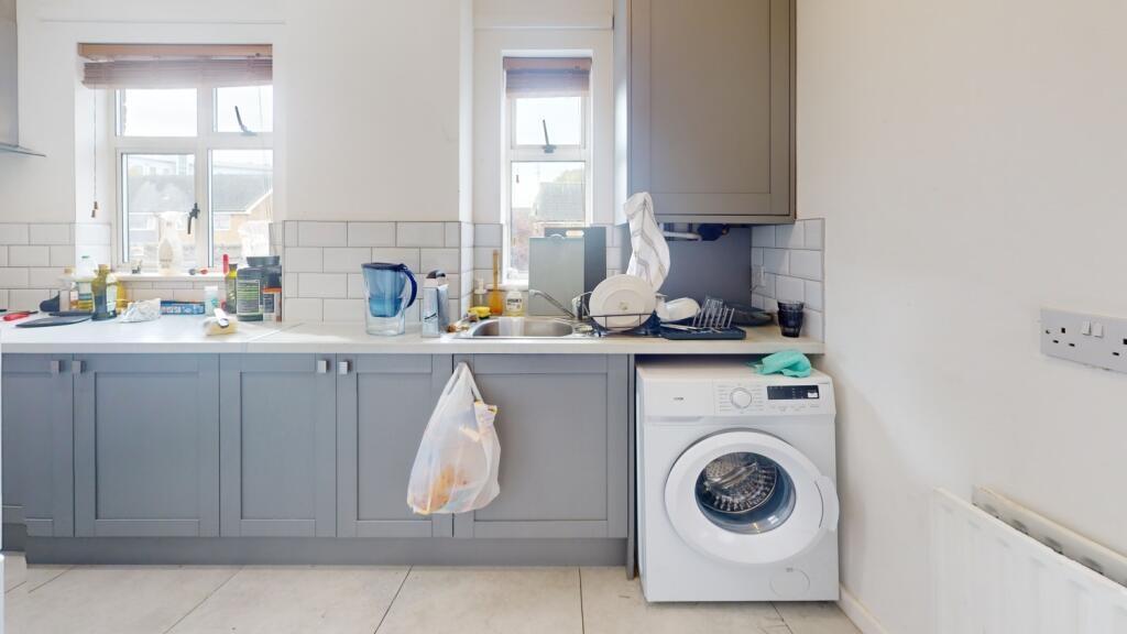 Bright and functional kitchen featuring ample c...