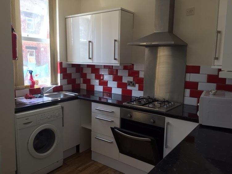 A well-maintained kitchen featuring modern appl...