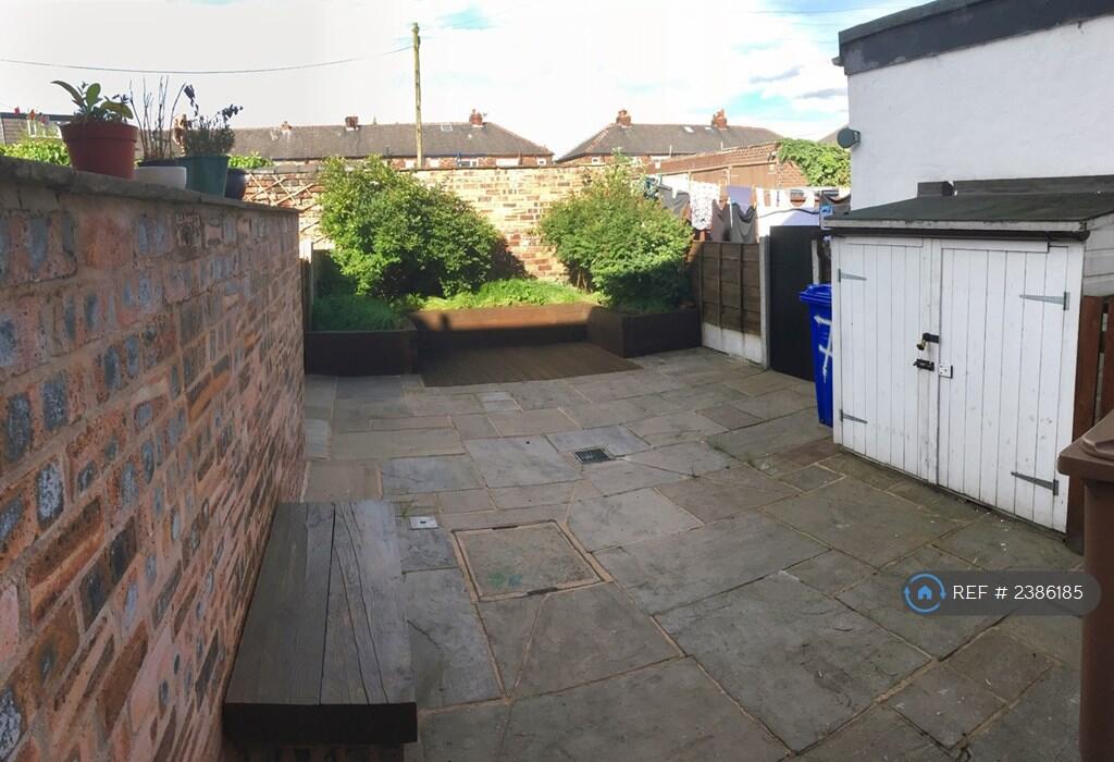 Garden Area With Flower Beds And Shed.