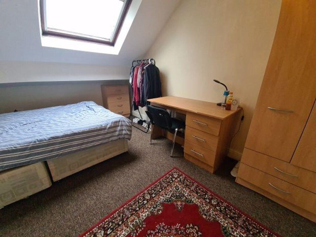 Cozy furnished bedroom with a comfortable singl...