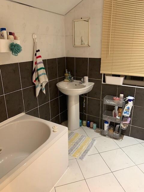 A clean and functional bathroom featuring a lar...