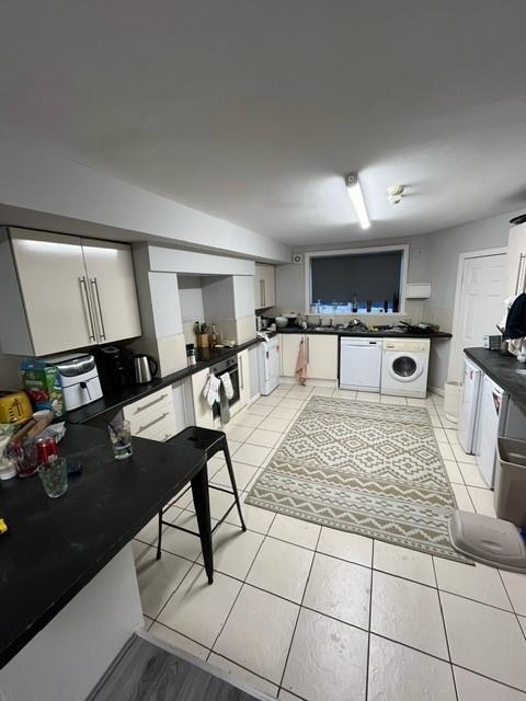 Bright, modern kitchen with plentiful storage, ...