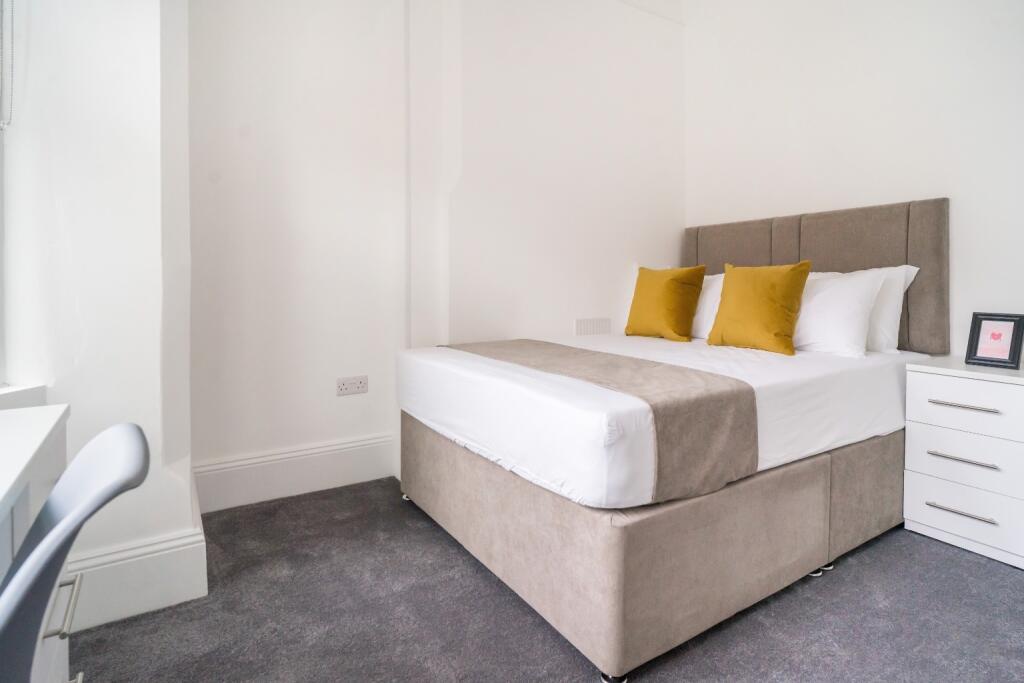 A stylish and inviting double bedroom featuring...