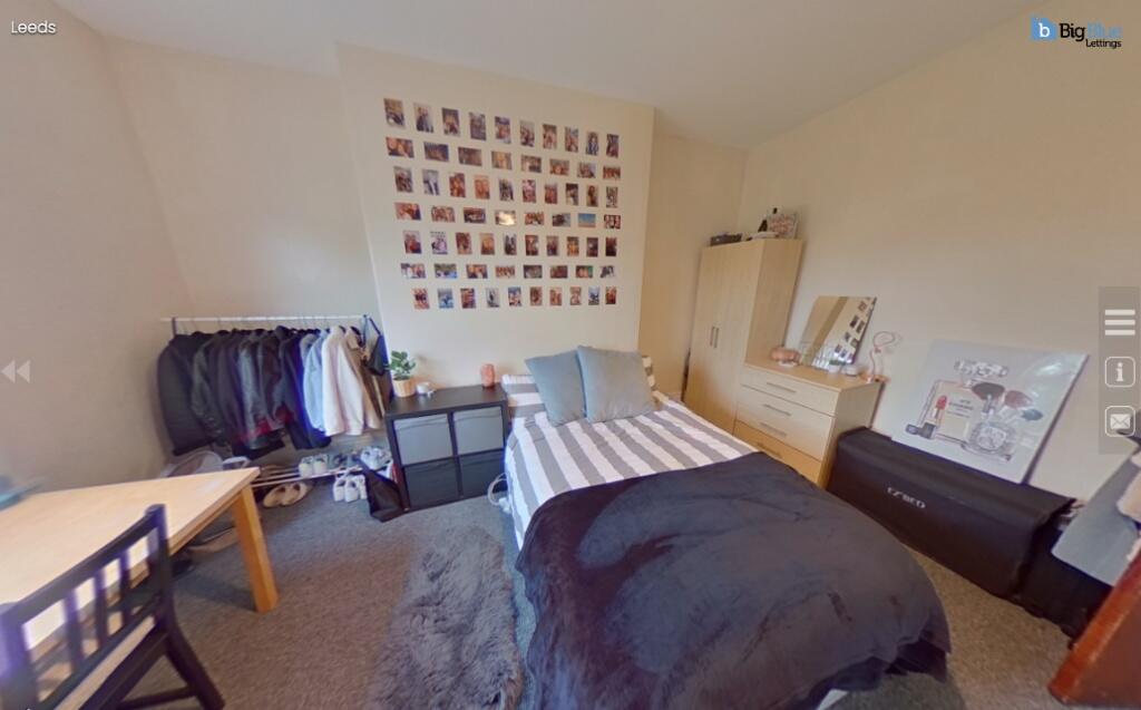 A cozy and inviting bedroom featuring a neatly ...