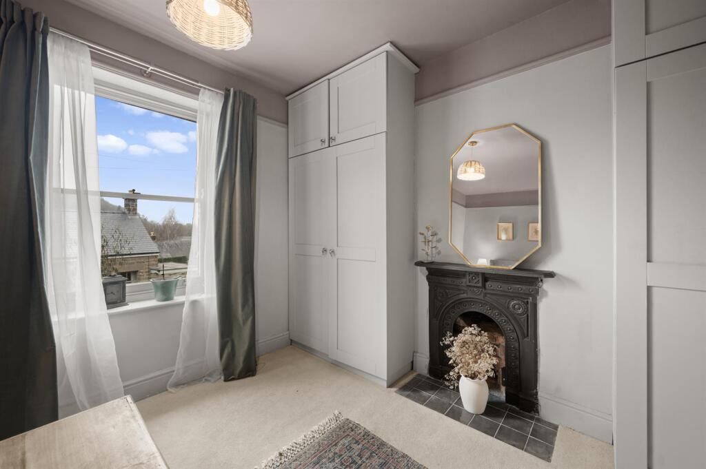 Bedroom Three - fireplace and window.jpg