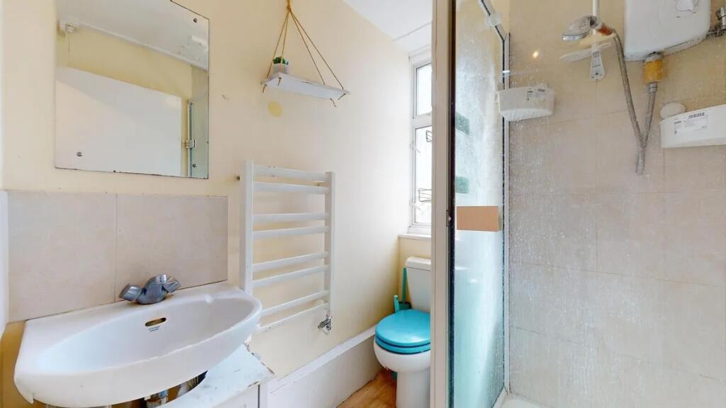 Bright and functional bathroom featuring a walk...