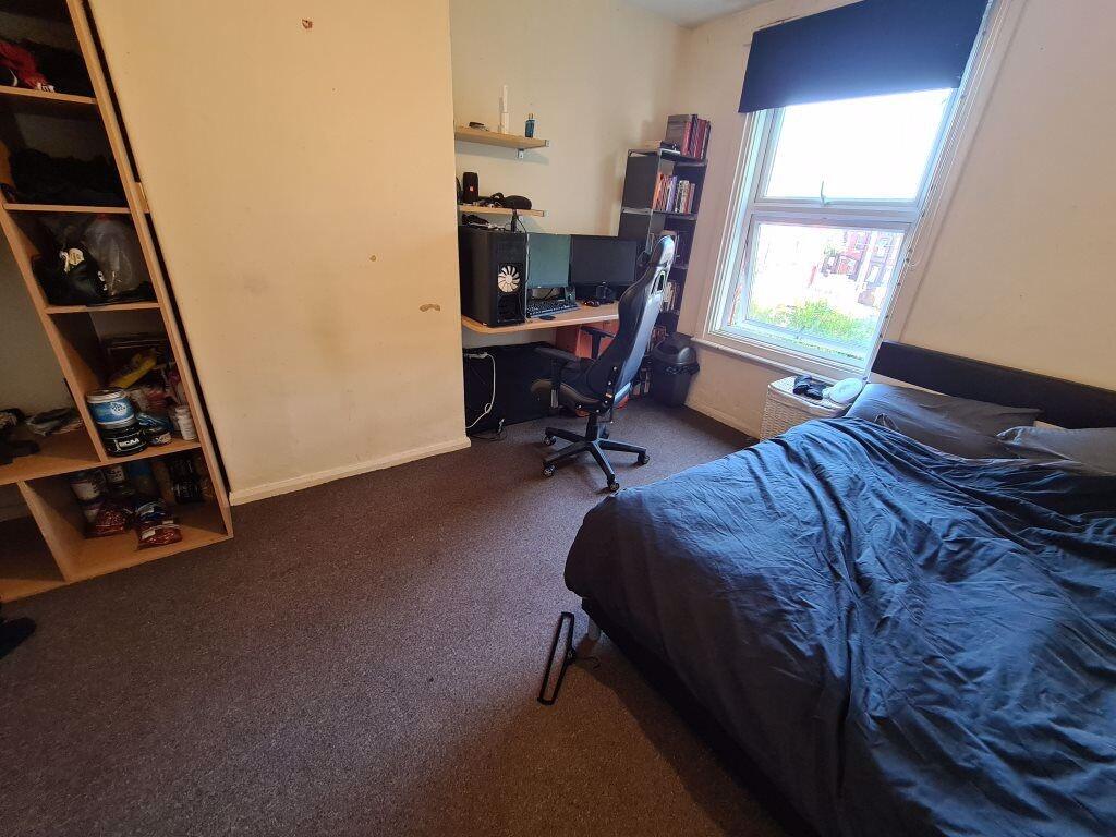 A cozy double bedroom featuring a comfortable d...