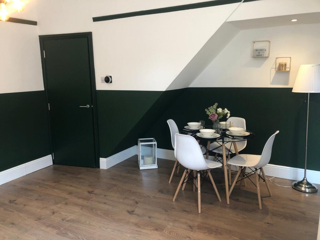 A stylish and inviting living room featuring a ...