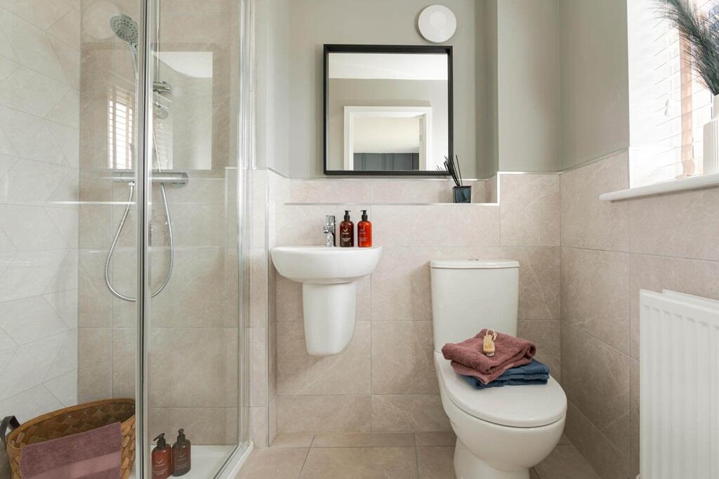 Bedroom 1 also features a private en suite shower room