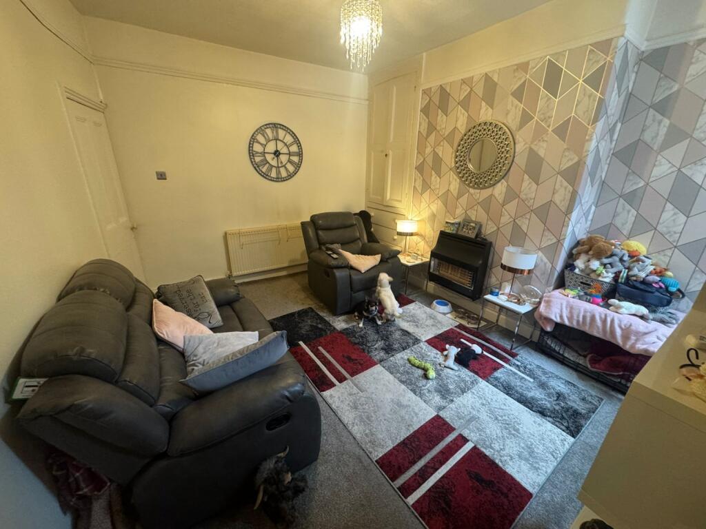 Cozy living room featuring comfortable sofas an...