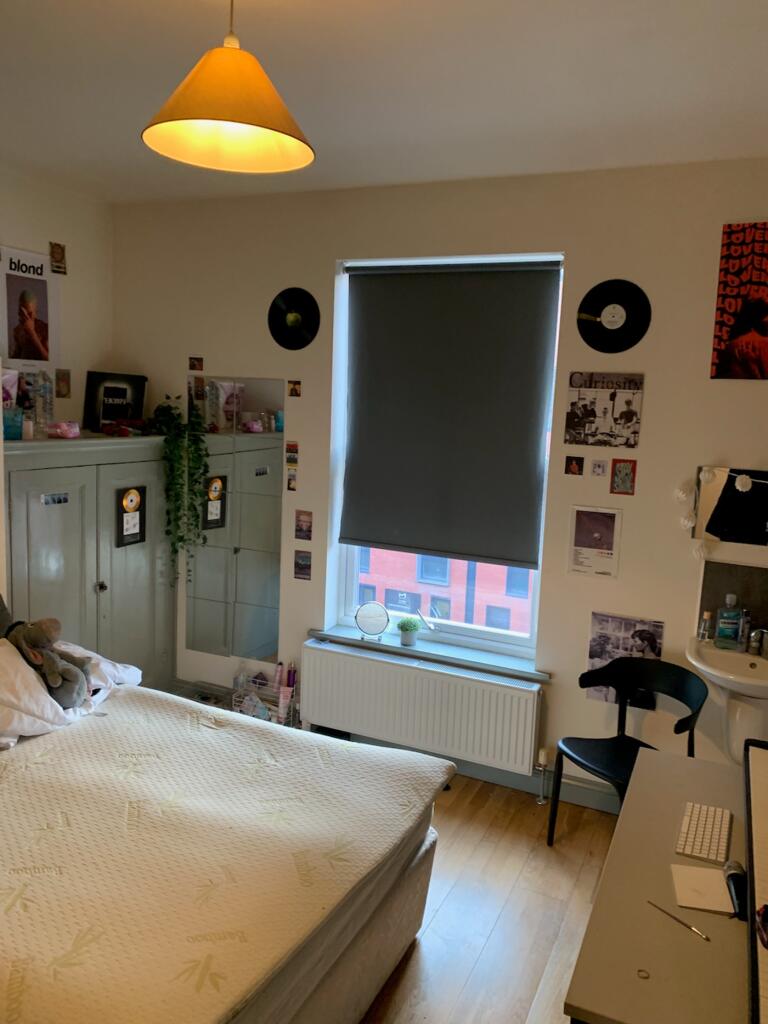 A cozy and inviting double bedroom with vibrant...